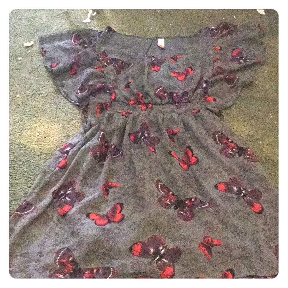 A Grey Butterfly dress with ruffles for sleeves